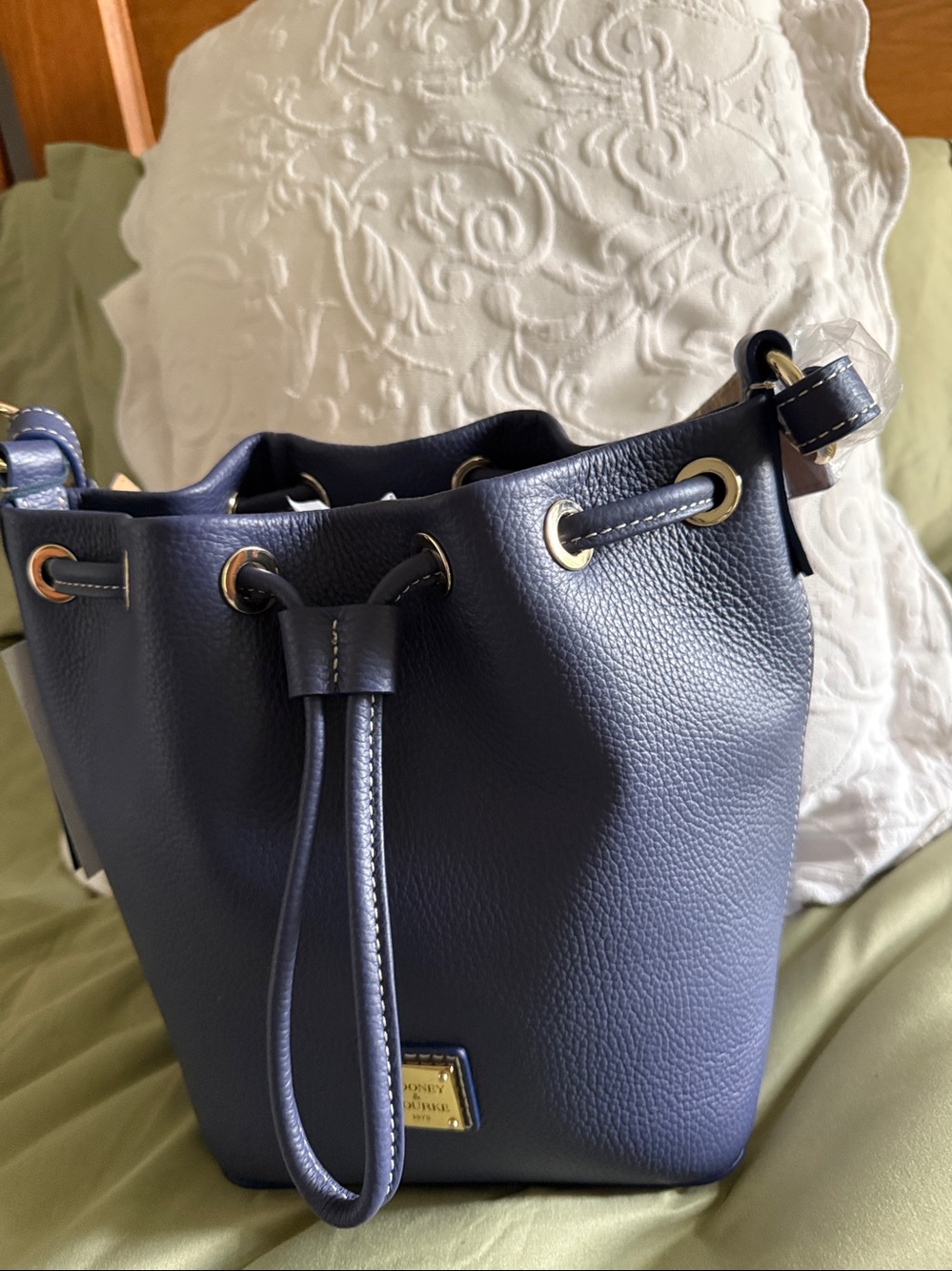 Dooney & Bourke Navy Blue Pebbled Leather Drawstring Bucket Bag with dust bag.